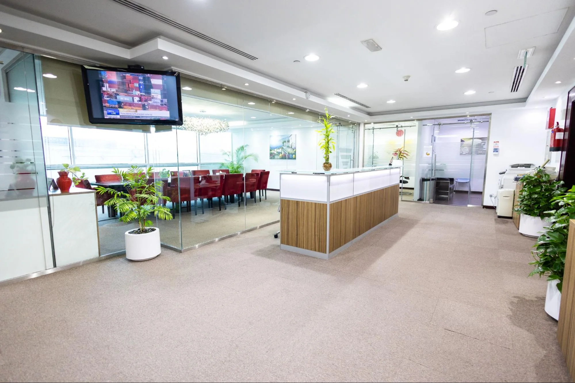 Concord Tower Dubai office space with reception, glass conference room, and modern furnishings.