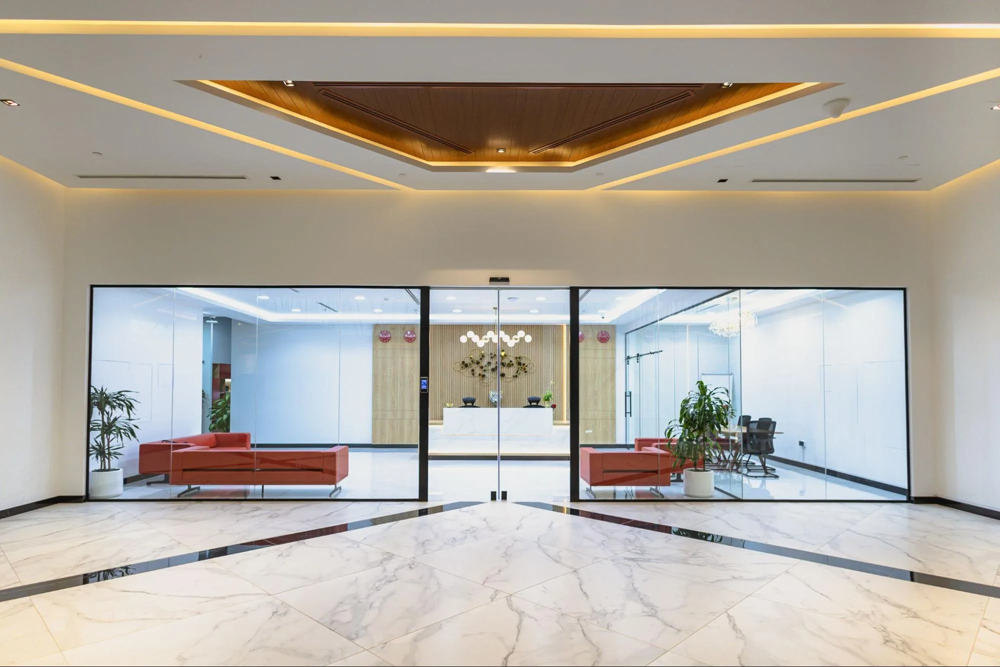 Al Hudaiba Mall Austria Business Center lobby with glass wall, white reception